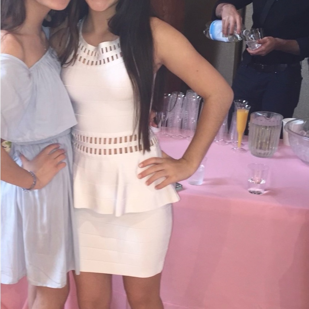 White Bebe dress with cutouts around the neck and waist. Tight & flattering.